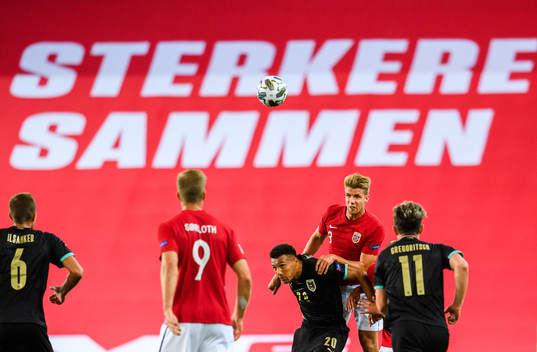 Karim Onisiwo of Austria against Kristoffer Ajer of Norway