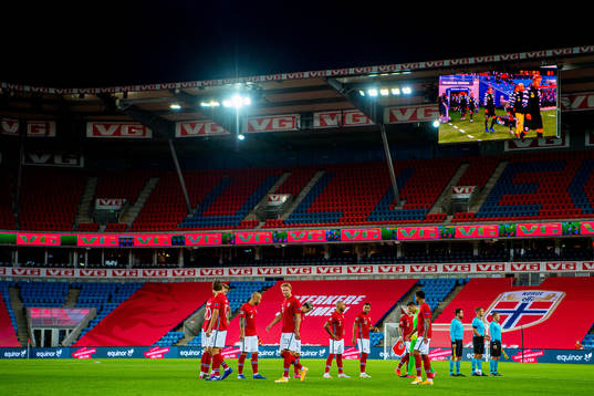 Erling Braut Haaland and the players of Norway enter the