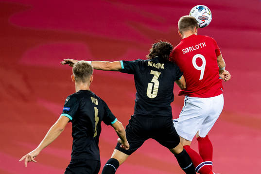 Aleksandar Dragovic of Austria and Alexander Sørloth of