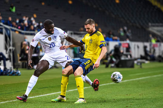 Dayot Upamecano of France and Marcus Berg of Sweden
