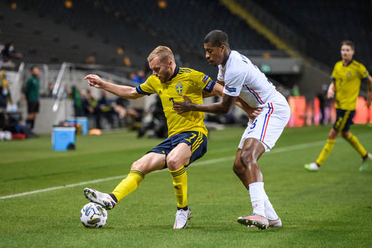 Sebastian Larsson of Sweden and Presnel Kimpembe of France