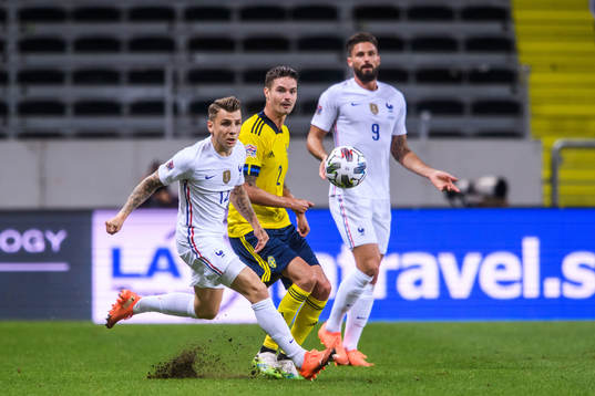 Lucas Digne and Olivier Giroud of France against Mikael