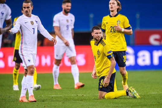 Antoine Griezmann of France and Marcus Berg of Sweden