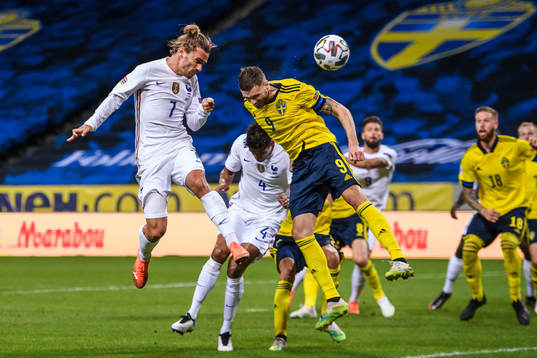 Antoine Griezmann of France and Marcus Berg of Sweden