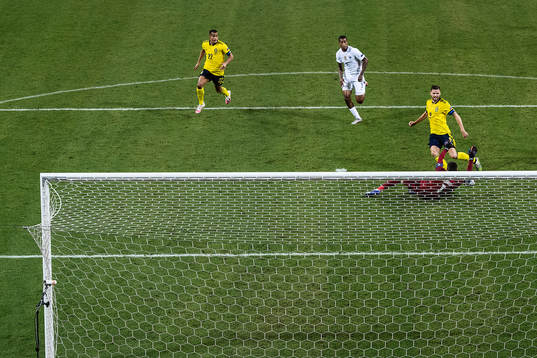 Marcus Berg of Sweden against goalkeeper Hugo Lloris of
