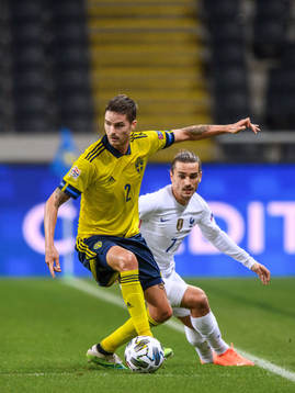 Mikael Lustig of Sweden and Antoine Griezmann of France