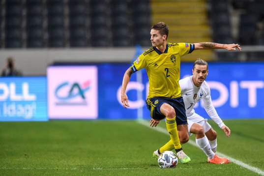 Mikael Lustig of Sweden and Antoine Griezmann of France