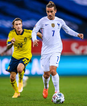 Kristoffer Olsson of Sweden and Antoine Griezmann of France