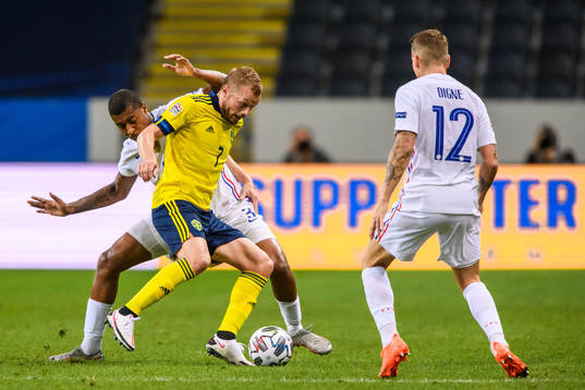 Presnel Kimpembe of France and Sebastian Larsson of Sweden