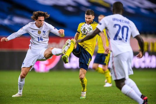 Adrien Rabiot of France and Marcus Berg of Sweden