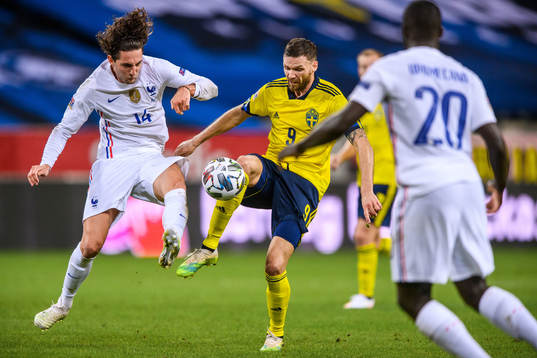 Adrien Rabiot of France and Marcus Berg of Sweden
