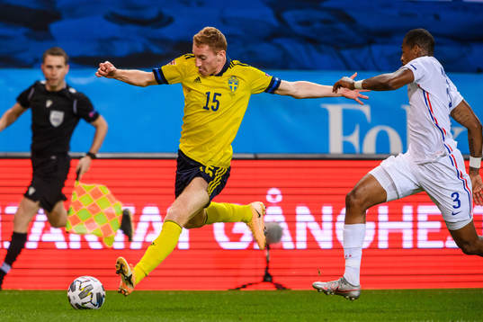 Dejan Kulusevski of Sweden and Presnel Kimpembe of France