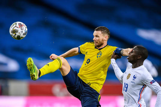 Marcus Berg of Sweden and Ferland Mendy of France