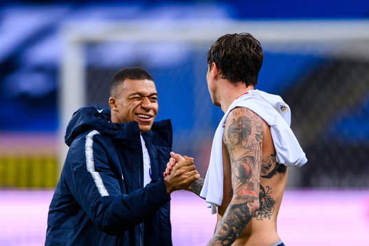 Kylian Mbappé of France and Victor Nilsson Lindelöf of