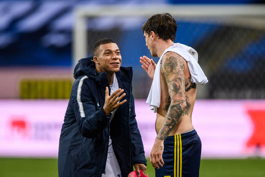 Kylian Mbappé of France and Victor Nilsson Lindelöf of