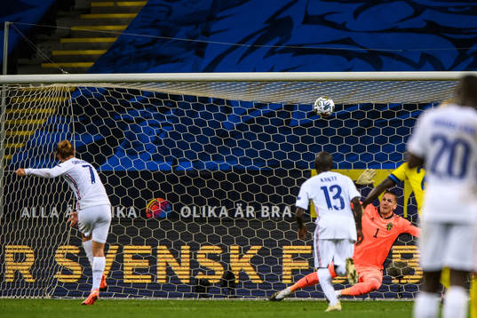 Antoine Griezmann of France misses a penalty behind