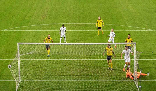 Goalkeeper Robin Olsen of Sweden lets in the 0-1 goal from