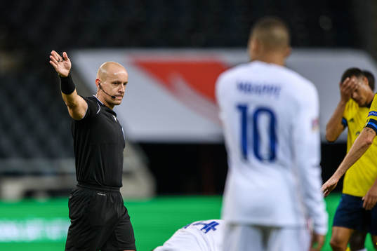Referee Szymon Marciniak