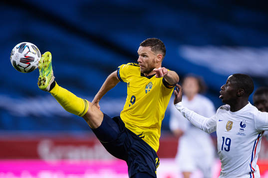 Marcus Berg of Sweden in action against Ferland Mendy of