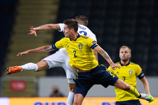 Lucas Digne of France and Mikael Lustig of Sweden
