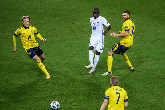 Emil Forsberg and Marcus Berg of Sweden against N'Golo