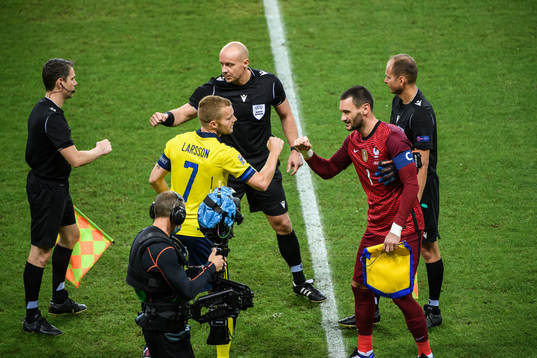 Sebastian Larsson of Sweden and goalkeeper Hugo Llorisof