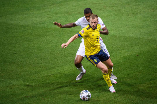 Sebastian Larsson of Sweden and Presnel Kimpembe of France