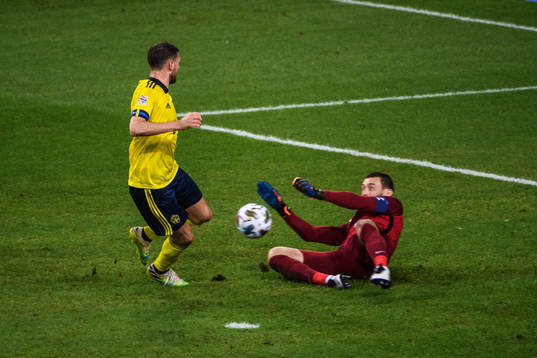 Marcus Berg of Sweden and goalkeeper Hugo Llorisof France