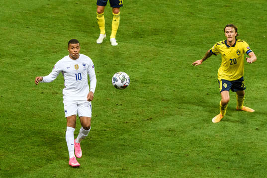 Kylian Mbappé of France and Kristoffer Olsson of Sweden