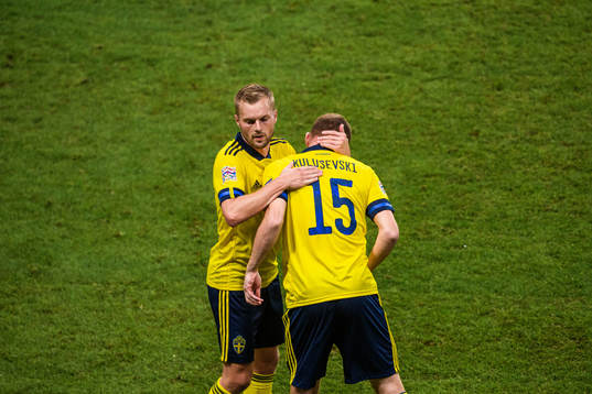Sebastian Larsson changes with Dejan Kulusevski of Sweden