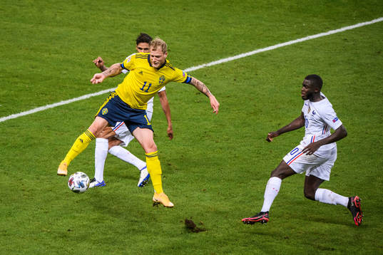 John Guidetti of Sweden and Dayot Upamecano of France