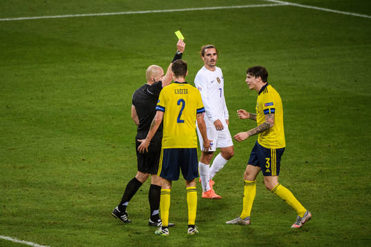 Victor Nilsson Lindelöf of Sweden receives a warning from