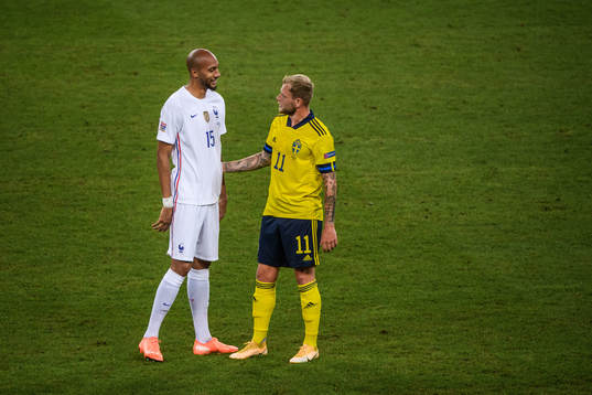 Steven Nzonzi of France and John Guidetti of Sweden