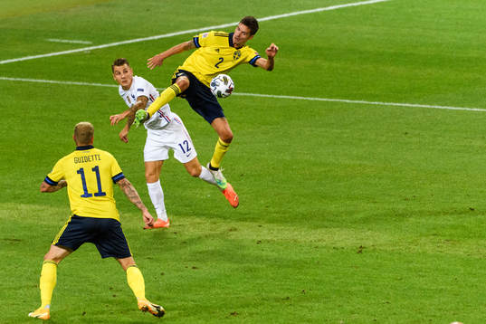 Mikael Lustig and John Guidetti of Sweden against Lucas