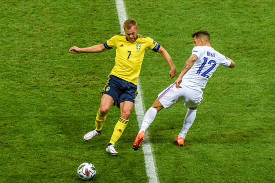 Sebastian Larsson of Sweden and Lucas Digne of France