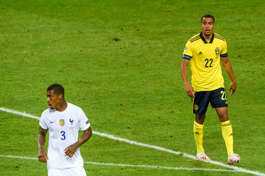Presnel Kimpembe of France and Robin Quaison of Sweden