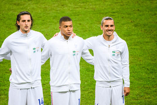 Adrien Rabiot , Kylian Mbappé and Antoine Griezmann of