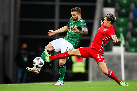 Stuart Dallas of Northern Ireland and Mathias Normann of