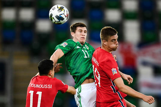 Paddy McNair of Northern Ireland and Markus Henriksen of