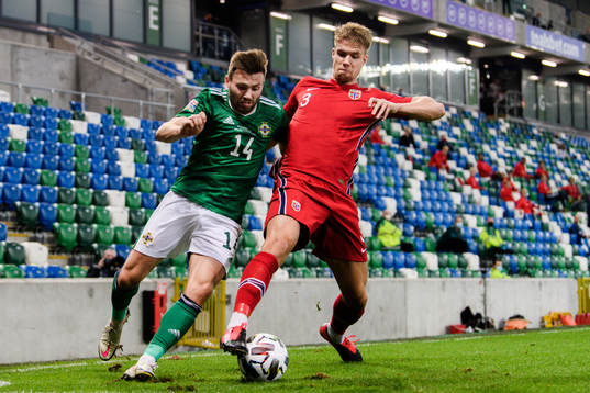 Stuart Dallas of Northern Ireland and Kristoffer Ajer of