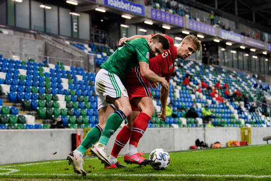Stuart Dallas of Northern Ireland and Kristoffer Ajer of