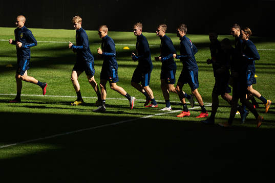 Players of the Swedish national football team warming up
