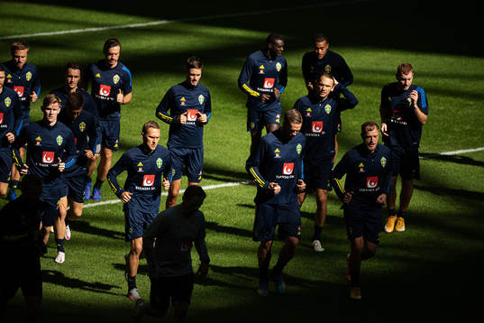 Players of the Swedish national football team warming up