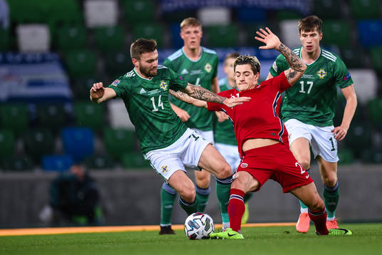 Stuart Dallas of Northern Ireland and Mathias Normann of