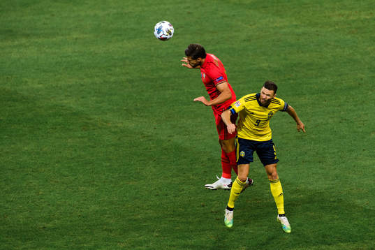 Ruben Dias of Portugal and Marcus Berg of Sweden