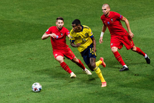 Alexander Isak of Sweden against Raphael Guerreiro and Pepe