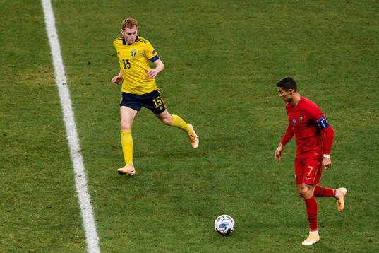 Dejan Kulusevski of Sweden and Cristiano Ronaldo of Portugal