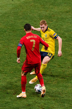 Dejan Kulusevski of Sweden and Cristiano Ronaldo of Portugal