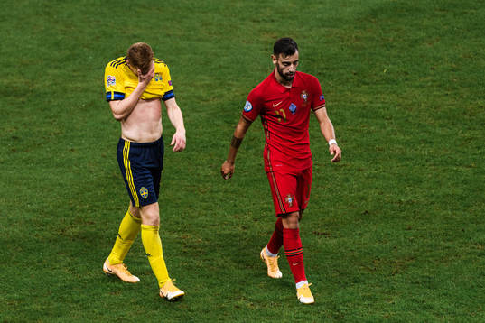 Dejan Kulusevski of Sweden and Bruno Fernandes of Portugal