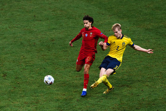 Joao Felix of Portugal and Filip Helander of Sweden